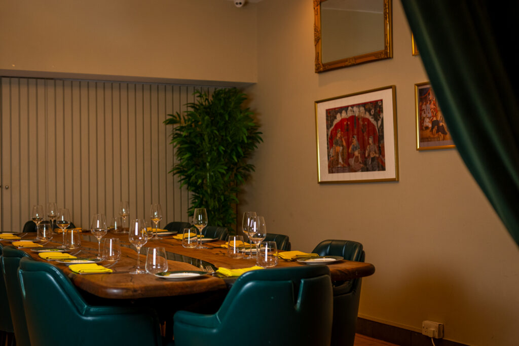 Tables laid in the dining room at Chatora City, ready for a private dinner near Bank